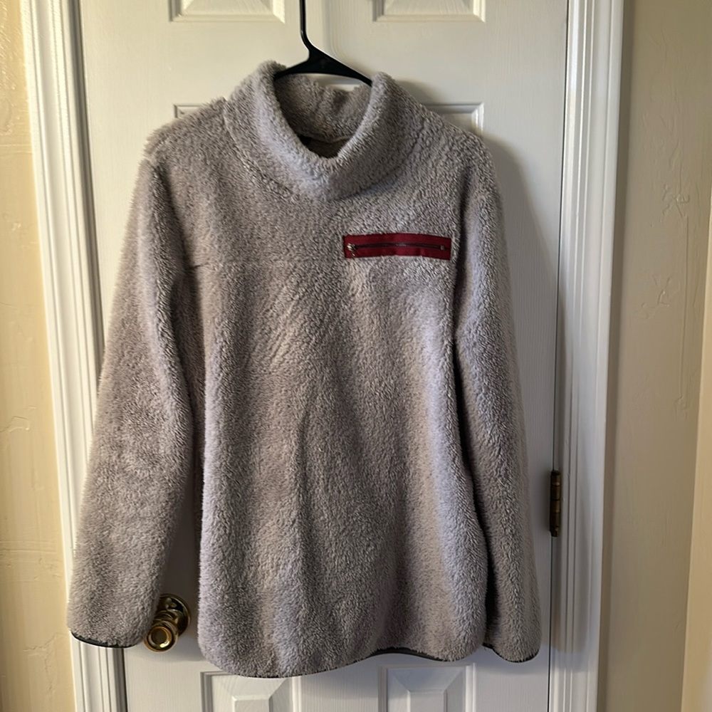 Women’s Sherpa pullover light grey,burgundy zipper right corner.